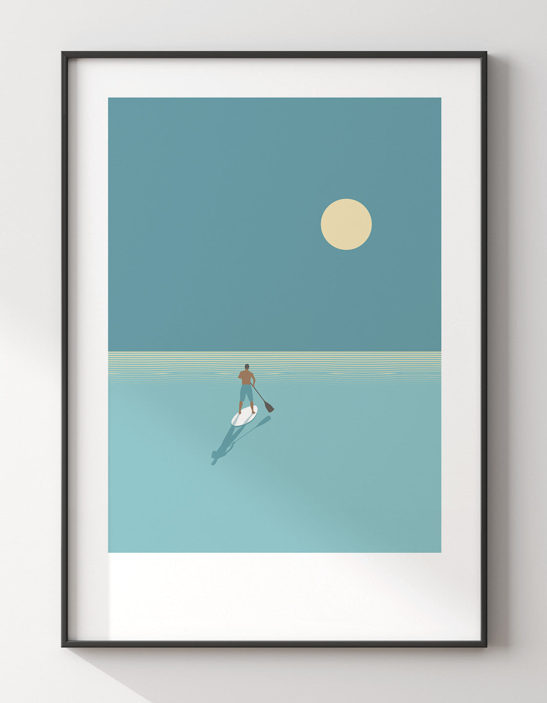Paddleboarder at sunset