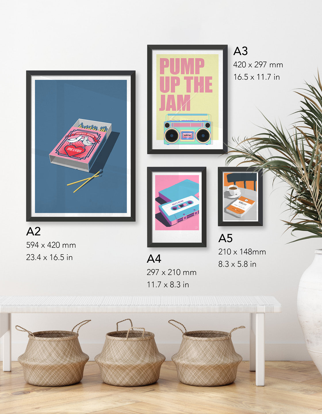 Image shows a selection of different sized print on the wall above a bench seat with rattan baskets beneath