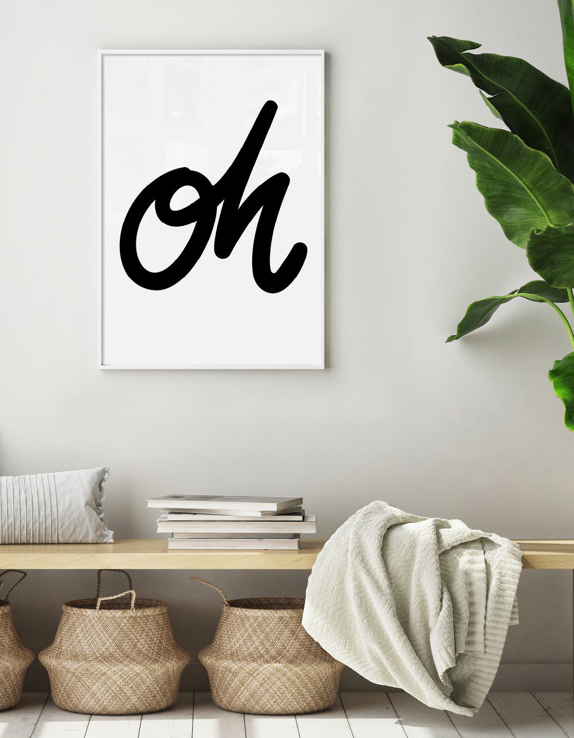 Monochrome typography print with the word oh in black cursive text on a white background