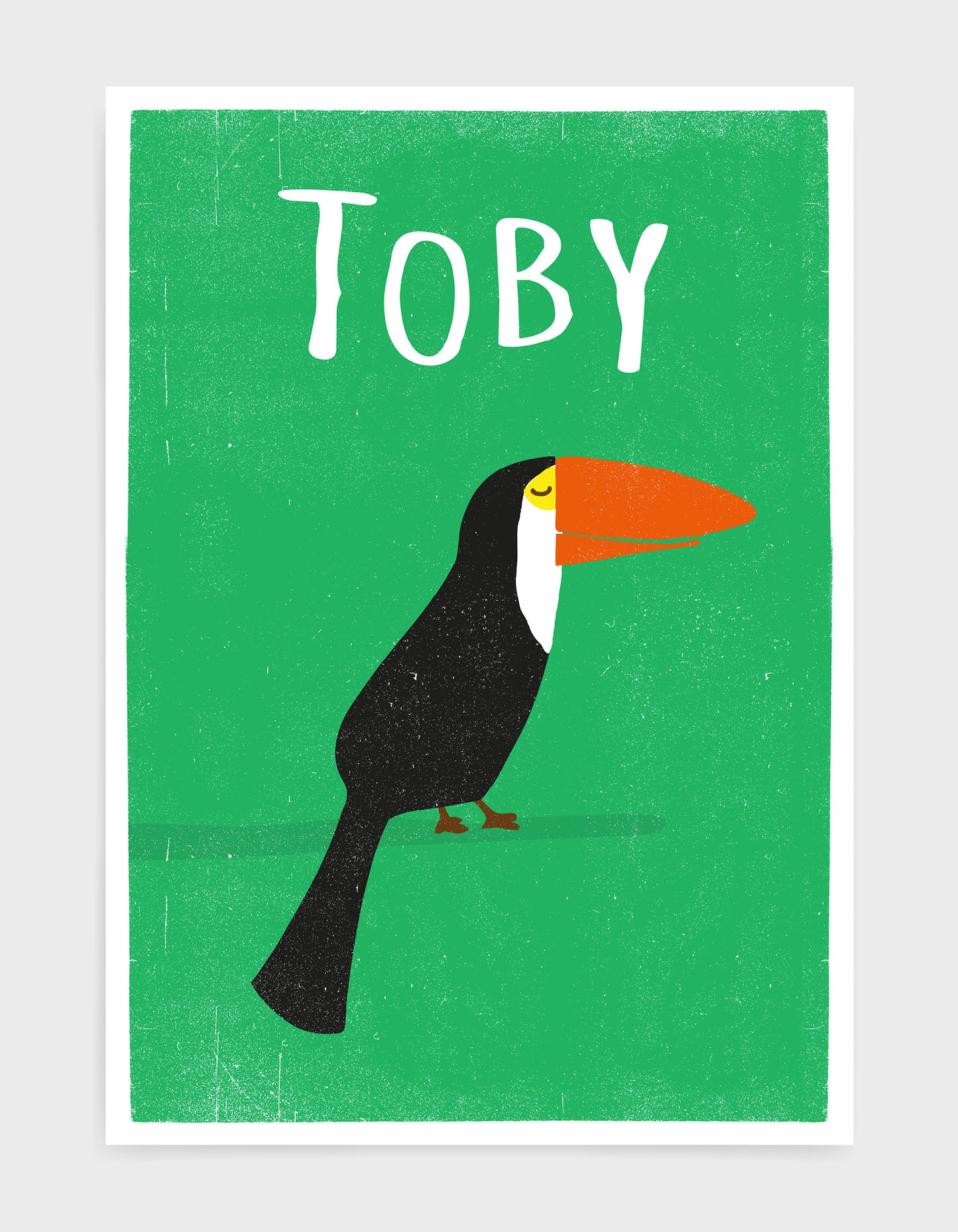 art print of a toucan bird in profile against a green background with child name above