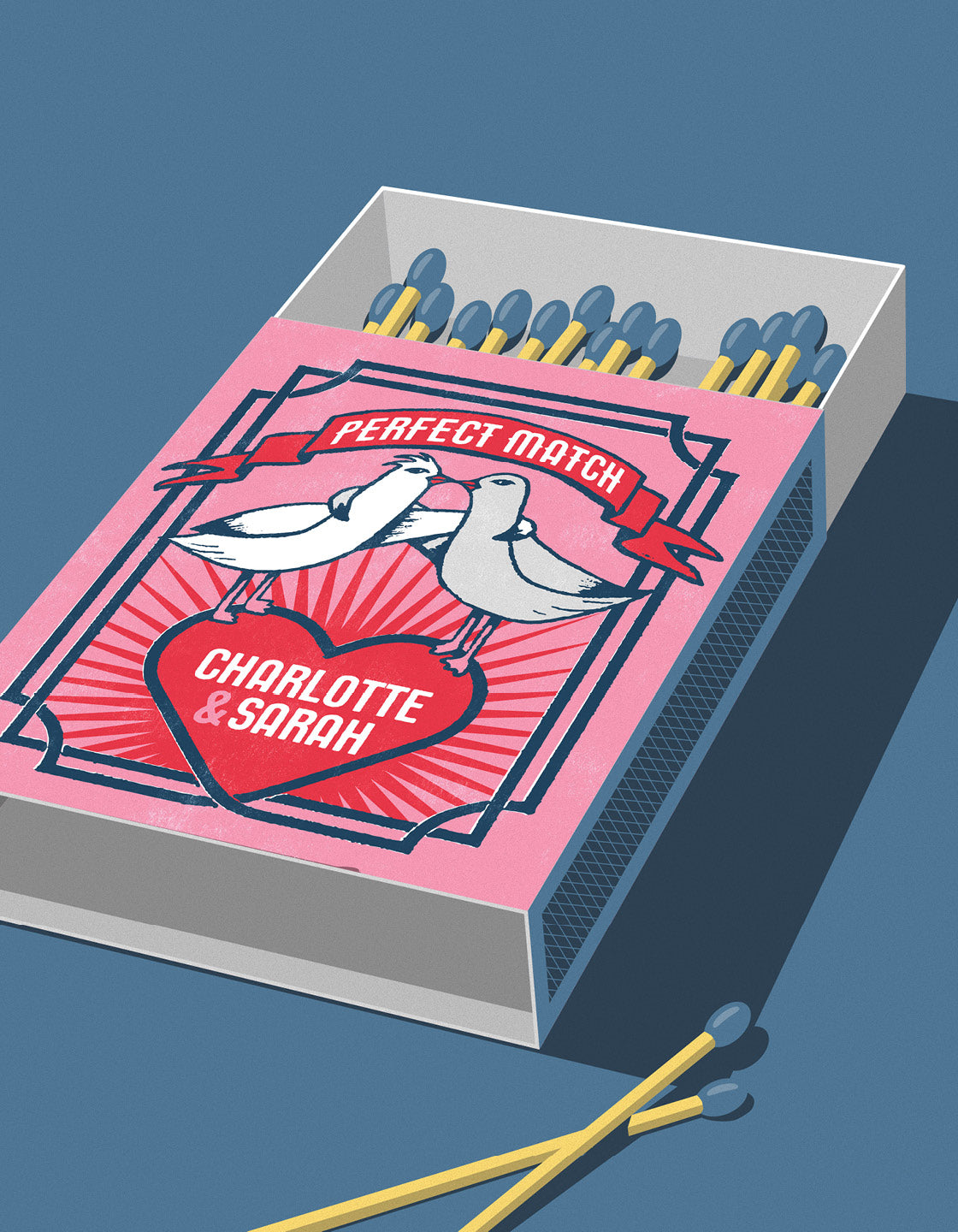 pink open matchbox against a blue background with two matches outside the box. Top of the box shows two doves and the title perfect match. A red heart sits beneath the birds and features Personalised text