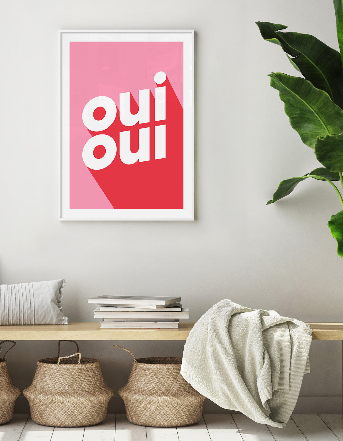 typography print with the words oui oui in bold lowercase type with red against a pink background