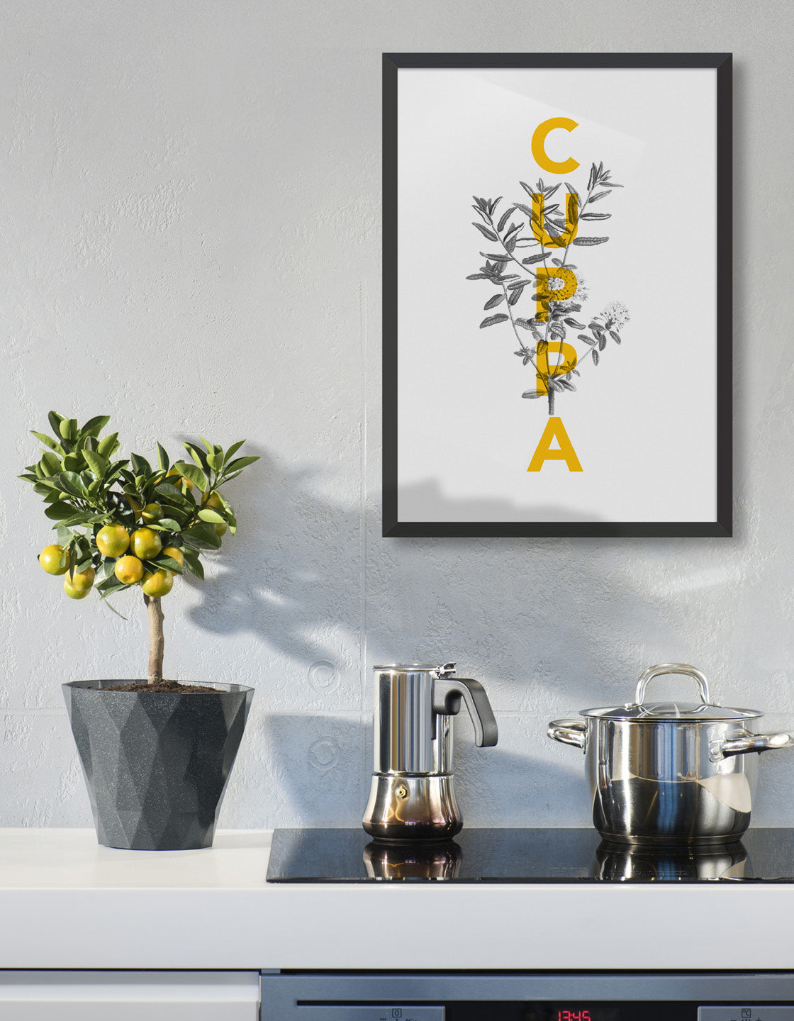 Cuppa typography print - features the text Cuppa in yellow overlaid onto a line drawing of a tea plant