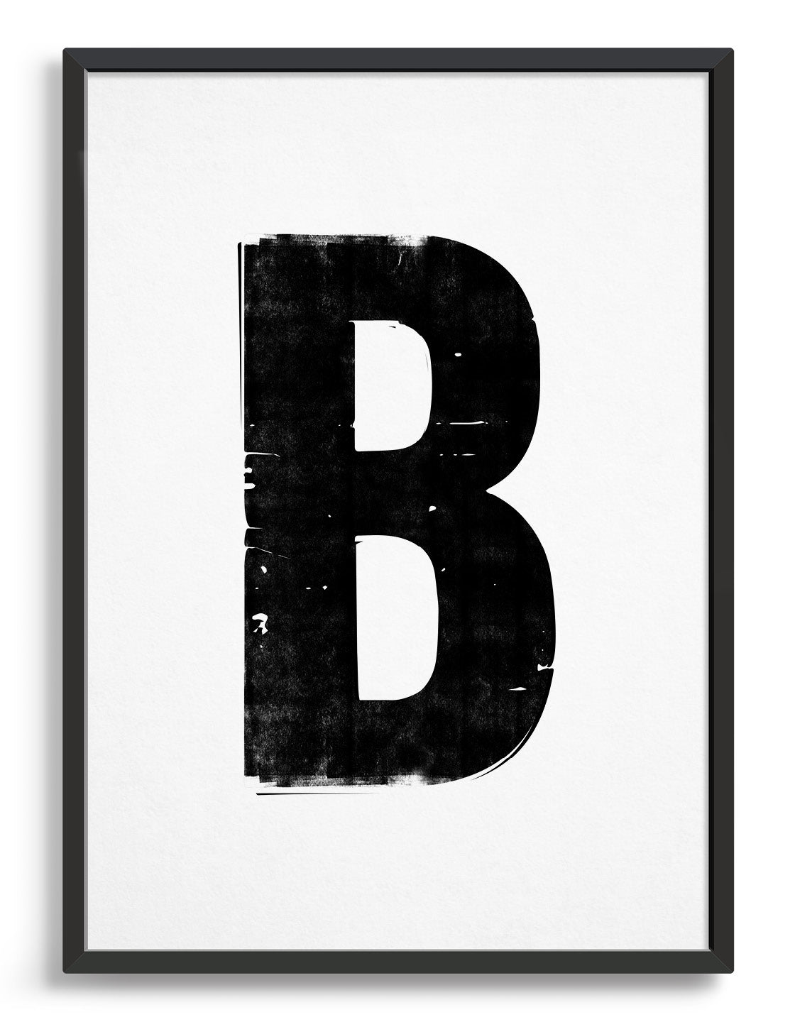 letterpress style alphabet print in blank font against a white background. Image depicts the letter B