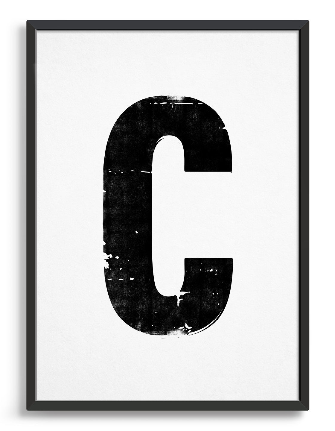 letterpress style alphabet print in blank font against a white background. Image depicts the letter C