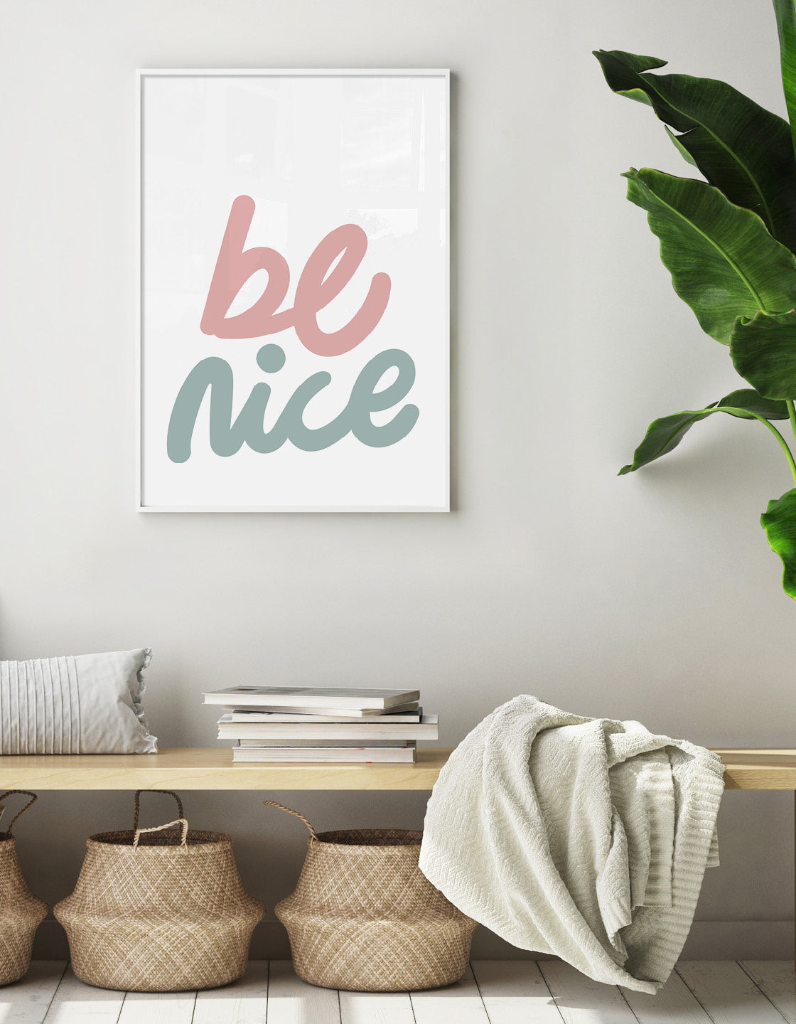 typography print of 'be nice' in cursive text in pastel colours on a white background
