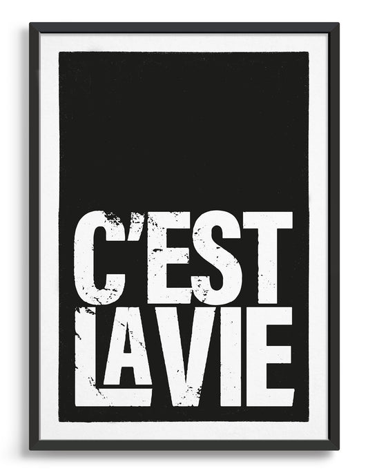 typography print with c'est la vie in white lettering at the bottom of a black background