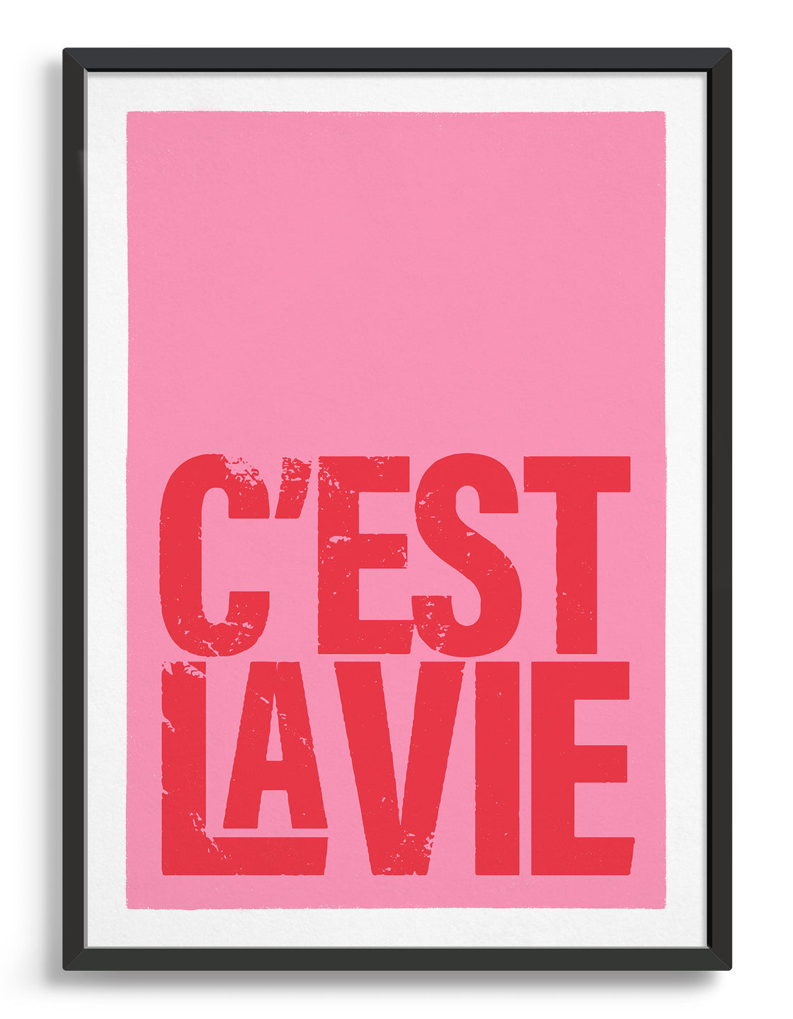 typography print with c'est la vie in red lettering at the bottom of a pink background